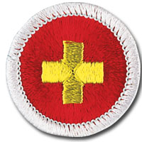 insignia de mérito (merit badge) de primeros auxilios